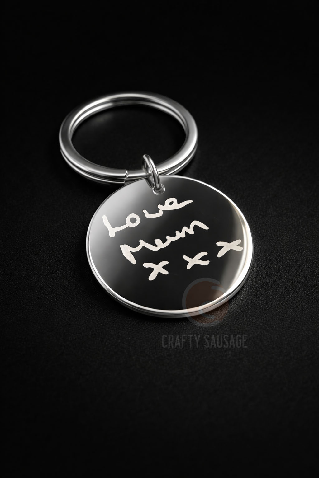 Keychain with 'Love Mum x x' engraved on a black background